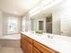 Bathroom with double vanity, garden tub, and window at 2640 Ironwood Dr, Hickory, NC 28602