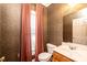 Charming bathroom with updated vanity and patterned wallpaper at 2640 Ironwood Dr, Hickory, NC 28602