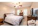 Bedroom with a queen bed, ceiling fan, and window at 2640 Ironwood Dr, Hickory, NC 28602