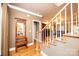 Elegant entryway with hardwood floors, staircase, and a charming bench at 2640 Ironwood Dr, Hickory, NC 28602