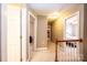 Upstairs hallway with doors to bedrooms at 2640 Ironwood Dr, Hickory, NC 28602