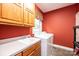 Laundry room with washer, dryer, cabinets, and a sink at 2640 Ironwood Dr, Hickory, NC 28602