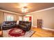 Relaxing living room with sectional sofa, hardwood floors, and access to deck at 2640 Ironwood Dr, Hickory, NC 28602