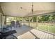 Covered porch with seating and woodland view at 1036 Lakeland Ave, Lincolnton, NC 28092