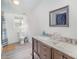 Bathroom with a double vanity, shower, and light-colored tile at 1036 Lakeland Ave, Lincolnton, NC 28092