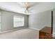 Bright bedroom with ceiling fan and large window at 1321 Linden Glen Dr, Matthews, NC 28104