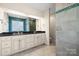 Elegant bathroom with double vanity and mosaic tile at 2488 Birdie Ne Ln, Conover, NC 28613