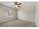 Well lit bedroom with large window and carpet at 2488 Birdie Ne Ln, Conover, NC 28613