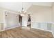 Formal dining room with hardwood floors and chandelier at 2488 Birdie Ne Ln, Conover, NC 28613