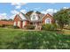 Brick home with landscaped yard at 2488 Birdie Ne Ln, Conover, NC 28613