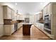 Spacious kitchen with an island, stainless steel appliances, and ample cabinet space at 2488 Birdie Ne Ln, Conover, NC 28613