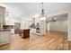 Open kitchen with an island, stainless steel appliances and hardwood floors at 2488 Birdie Ne Ln, Conover, NC 28613