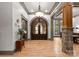 Elegant entryway with arched doors and hardwood floors at 9716 Sweetleaf Pl, Charlotte, NC 28278