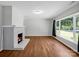 Living room features a brick fireplace and hardwood floors at 806 N Flint St, Lincolnton, NC 28092