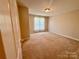 Spacious bedroom with neutral carpeting and large windows at 125 Snead Rd, Fort Mill, SC 29715