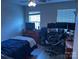 Bedroom with twin bed, large dresser and triple monitors at 7308 Gallery Pointe Ln, Charlotte, NC 28269