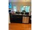 Kitchen island with granite countertop and sink at 7308 Gallery Pointe Ln, Charlotte, NC 28269