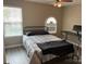Bright bedroom with a double bed, window, and workspace at 7308 Gallery Pointe Ln, Charlotte, NC 28269