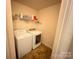 Convenient laundry room with washer and dryer at 7308 Gallery Pointe Ln, Charlotte, NC 28269