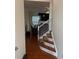 Inviting entryway with hardwood floors and staircase leading upstairs at 7308 Gallery Pointe Ln, Charlotte, NC 28269