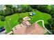 Aerial view showing a house with a large backyard, playground, and pool at 12708 Hamilton Rd, Charlotte, NC 28273
