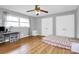 Bedroom with hardwood floors, ceiling fan, and double closets at 12708 Hamilton Rd, Charlotte, NC 28273
