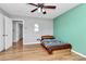 Charming bedroom with wood floors and a view of the hallway at 12708 Hamilton Rd, Charlotte, NC 28273