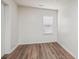Bright bedroom featuring wood-look flooring and a window with blinds at 804 Sowell St, Lancaster, SC 29720