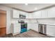 Modern kitchen with white cabinets, stainless steel appliances, and quartz countertops at 804 Sowell St, Lancaster, SC 29720