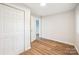 Bedroom with double door closet and wood-look flooring at 804 Sowell St, Lancaster, SC 29720
