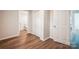 Hallway with wood-look flooring and access to bathroom and bedroom at 804 Sowell St, Lancaster, SC 29720