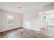 Bright living room with hardwood floors, open to kitchen at 804 Sowell St, Lancaster, SC 29720
