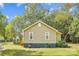 Side view of a light tan house with white trim and two windows at 804 Sowell St, Lancaster, SC 29720
