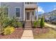 Brick steps leading to the front door, with landscaping on either side at 10193 Meeting House Nw Dr, Huntersville, NC 28078