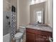 Guest bathroom with shower/tub combo and granite countertop at 10193 Meeting House Nw Dr, Huntersville, NC 28078
