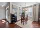 Charming dining area with a table for four and hardwood floors at 10193 Meeting House Nw Dr, Huntersville, NC 28078