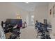 Home office with large monitor, desk, and comfortable chair at 10193 Meeting House Nw Dr, Huntersville, NC 28078