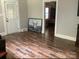 Living room with hardwood floors and access to other rooms at 305 N Milford Dr, Salisbury, NC 28144