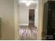 Hallway connecting kitchen to other rooms with hardwood floors at 305 N Milford Dr, Salisbury, NC 28144