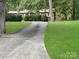 Long driveway leading to a brick ranch house at 305 N Milford Dr, Salisbury, NC 28144