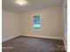 Spacious bedroom with plush carpeting and ample natural light at 1176 Shearers Rd, Mooresville, NC 28115