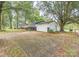 Ranch style home with a spacious driveway and mature trees at 519 S Mulberry St, Cherryville, NC 28021