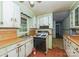 Kitchen with vintage cabinetry and appliances. Needs renovation at 519 S Mulberry St, Cherryville, NC 28021