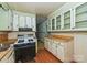 Kitchen with vintage cabinetry and appliances. Needs renovation at 519 S Mulberry St, Cherryville, NC 28021