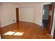 Spacious bedroom with hardwood floors and access to another room at 2124 W Main St # C, Albemarle, NC 28001