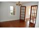 Classic dining room with hardwood floors and French doors leading to another room at 2124 W Main St # C, Albemarle, NC 28001