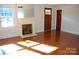 Living room boasts hardwood floors, fireplace, and large windows at 2124 W Main St # C, Albemarle, NC 28001