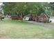 Brick house with carport and expansive lawn at 2124 W Main St # C, Albemarle, NC 28001
