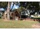 Brick house with attached carport, large trees, and yard at 2124 W Main St # C, Albemarle, NC 28001