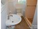 Clean bathroom with pedestal sink, toilet, and shower at 2124 W Main St # C, Albemarle, NC 28001